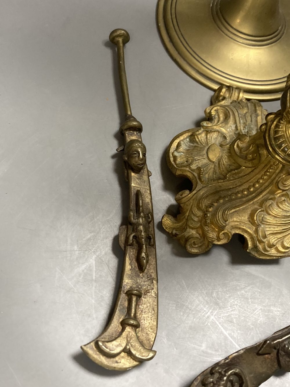 An 18th century French ormolu candlestick, 25cm, a pair of 19th century tubular brass ejector candlesticks, 46cm and two Chinese brass